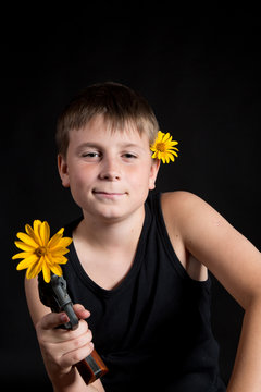 teenager with a gun and flowers