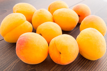 Fresh apricots on wooden table