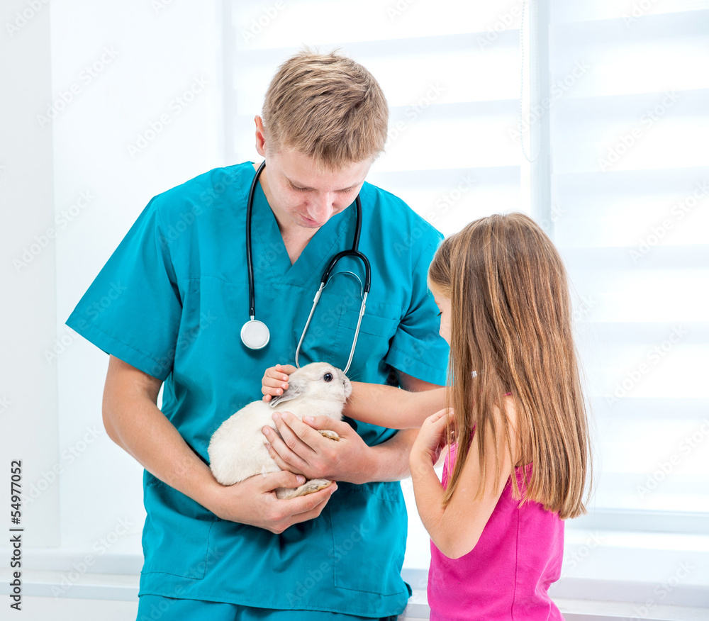 Wall mural doctor and little girl with a rabbit