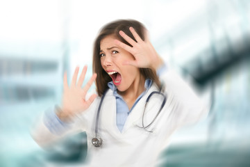 Surprised shocked scared doctor woman afraid