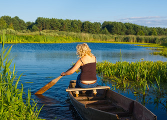 Woman rowing on river