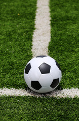 Fototapeta na wymiar Soccer ball on field