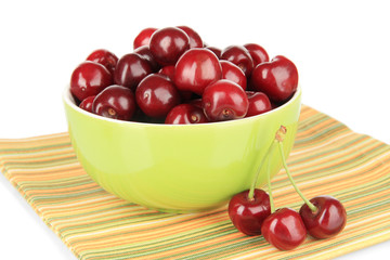 Cherry berries in bowl isolated on white
