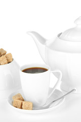 Cup of coffee, sugar-bowl and teapot isolated on white