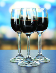 Glasses of liquor,  on bright background