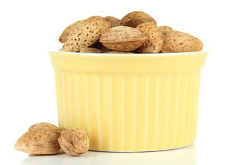 Almond in bowl, isolated on white