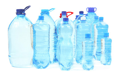 Water in different bottles isolated on white