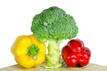 Colored paprika (pepper) and Broccoli on a white background