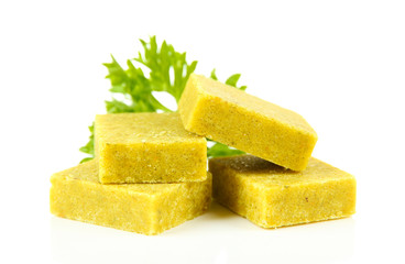 Bouillon cubes with parsley, isolated on white