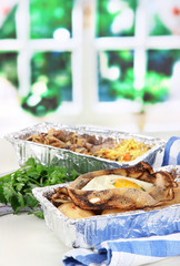 Food in boxes of foil