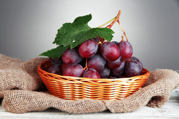 Ripe delicious grapes in wicker basket