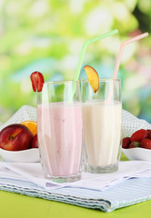 Delicious milk shakes with strawberries and peach