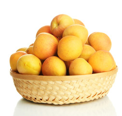 Fresh natural apricot in wicker basket isolated on white