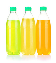 Bottles with tasty drinks, isolated on white