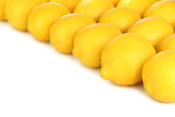 Ripe lemons on white background