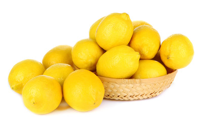 Ripe lemons in wicker basket isolated on white