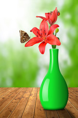 Lily with butterfly Morpho in green vase