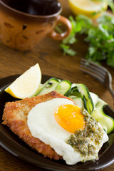 Wiener schnitzel with fried egg and capers.