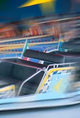 Foto auf Leinwand Spinning ride in an amusement park © XtravaganT