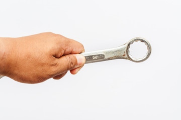 Hand and wrench on white background.