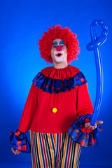 Clown on blue backgound © DC Studio