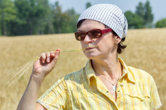 Organic farmer examines their corn field