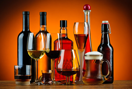Naklejka Bottles and glasses of alcohol drinks