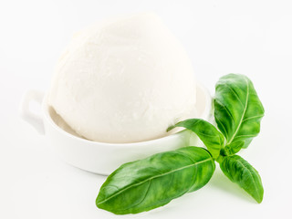 Cheese mozzarella  ball with basil leaf isolated on white