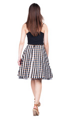 back view of walking  woman .