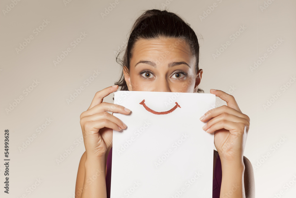 Wall mural happy and smiling girl with a smile painted on paper