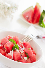 Salad with watermelon, cheese and mint.