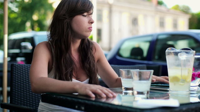 Sad woman waiting for boyfriend in cafe, steadicam shot