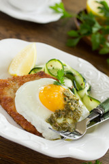 Wiener schnitzel with fried egg and capers.