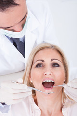Dentist Examining Patient