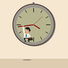 Businessman hangs on an arrow of clock