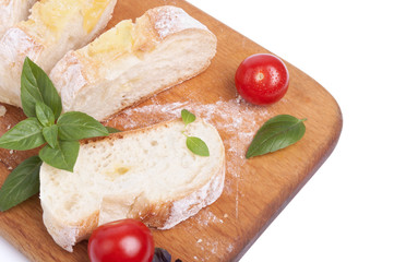 Cutting board with tomato and bread