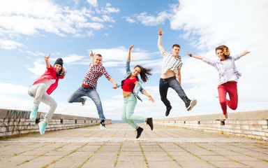 group of teenagers jumping