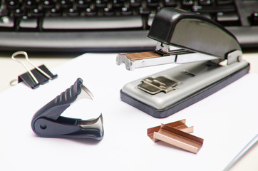 Office objects on white paper.