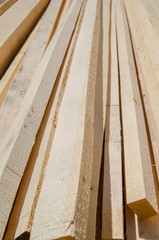 Stacks of wood building planks in warehouse