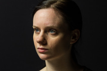 Young woman smiling at camera, vertical