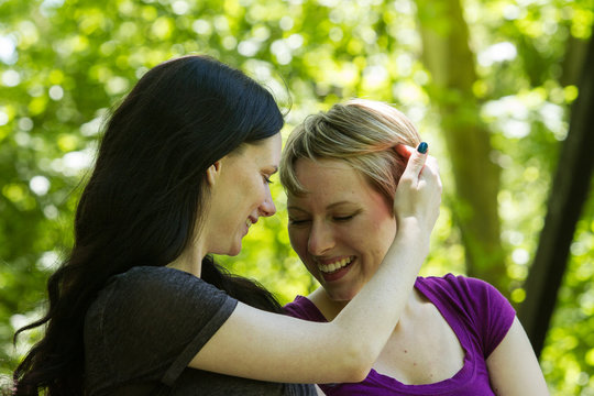Affectionate lesbian couple, horizontal