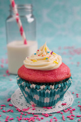 Pink cupcake and milk