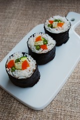 Vegetarian sushi maki rolls with tofu and nori seaweed