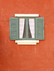 Vintage window on cement wall