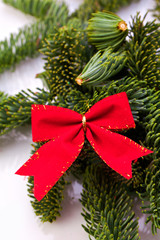 christmas decoration with red ribbon and fir tree
