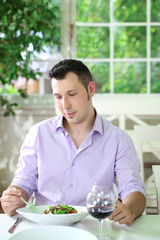 Handsome  man waiting  woman at restaurant