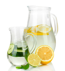 Cold water with lemon, cucumber and ice in pitchers isolated