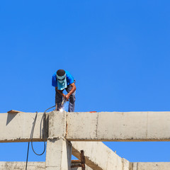 welder worker welding metal. Bright electric arc and sparks