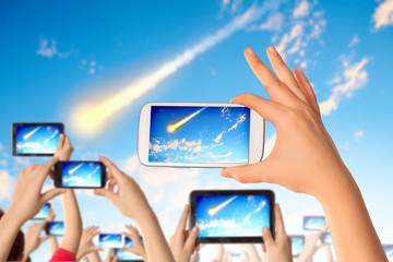 People taking photo of meteorite