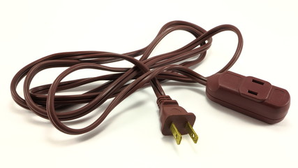 Brown electrical extension cord on a white back ground